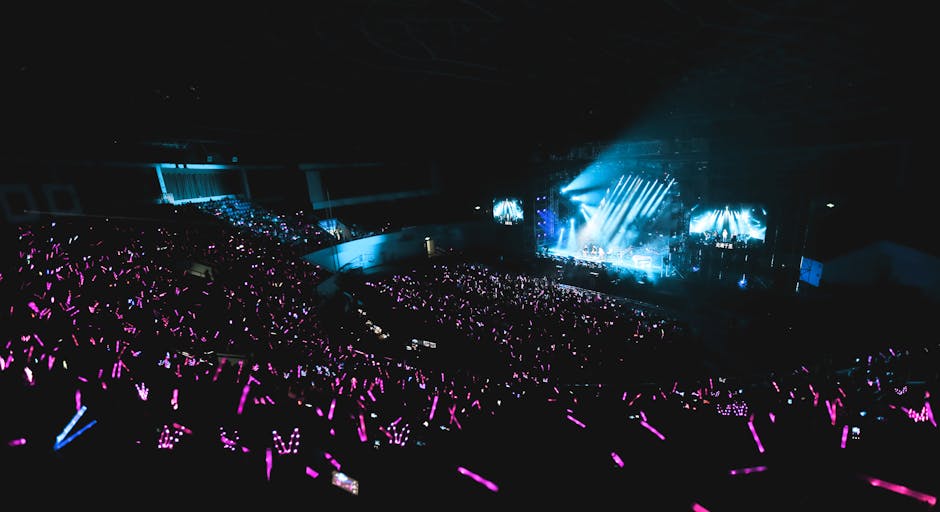 Exciting live concert with a massive audience and colorful light sticks